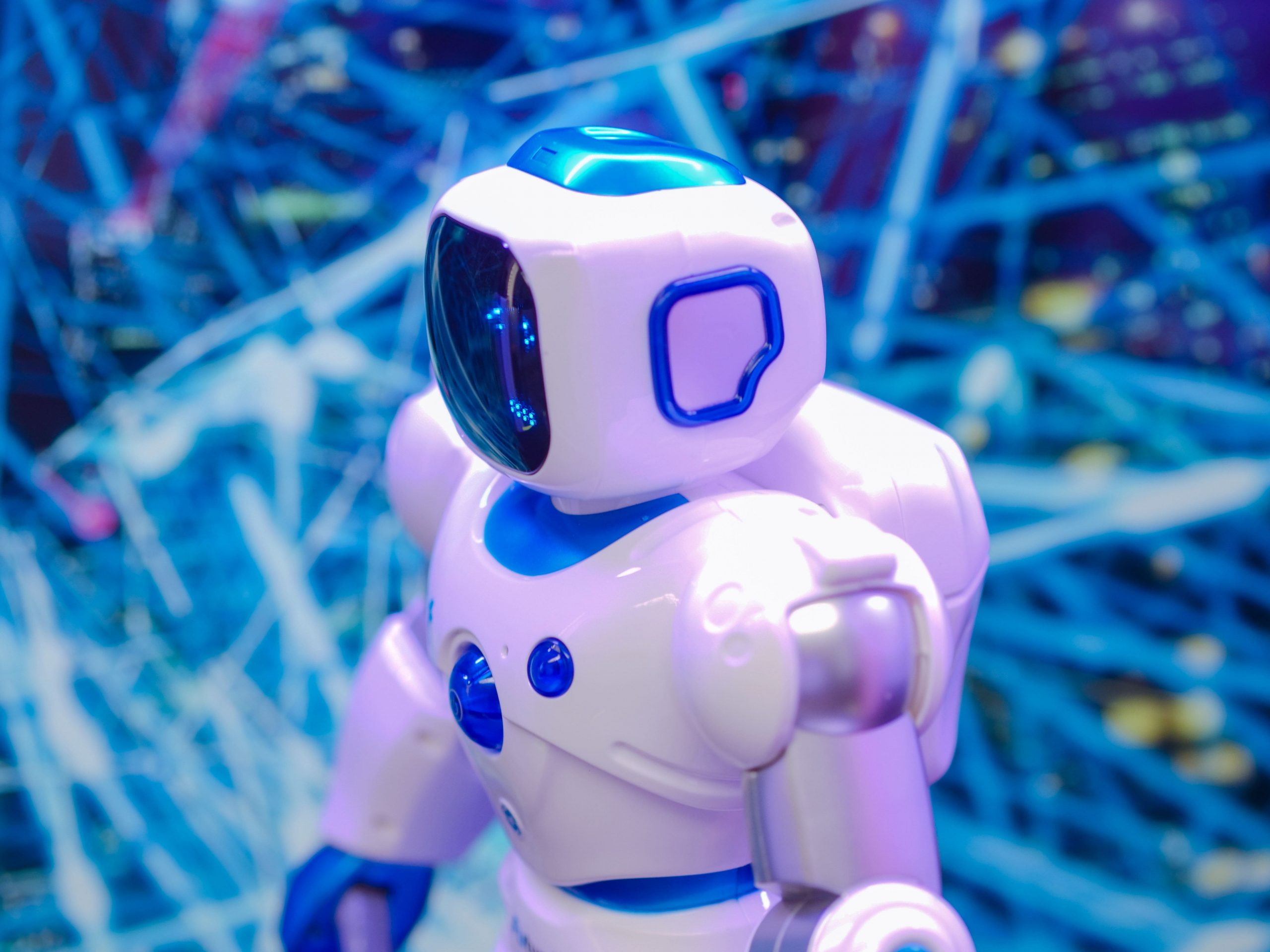 Developers building artificial intelligence software with machine learning algorithms, cloud computing, data analytics, and futuristic digital technology.