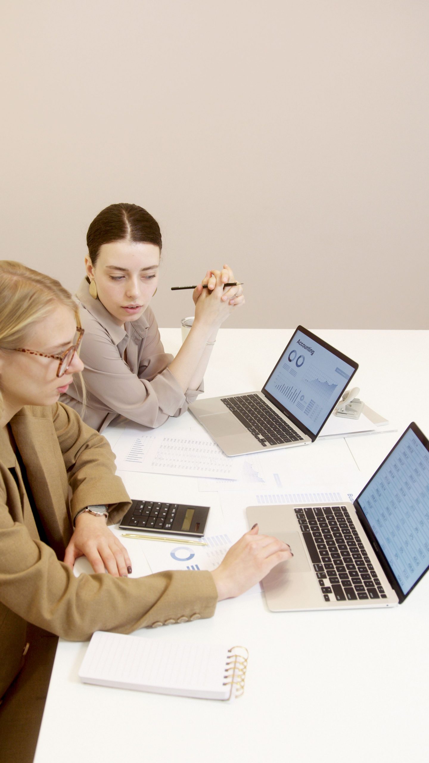 A two business women writing a business plan